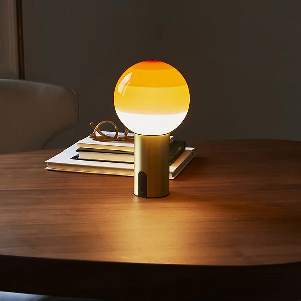 dipping light led portable table lamp by jordi canudas for marset